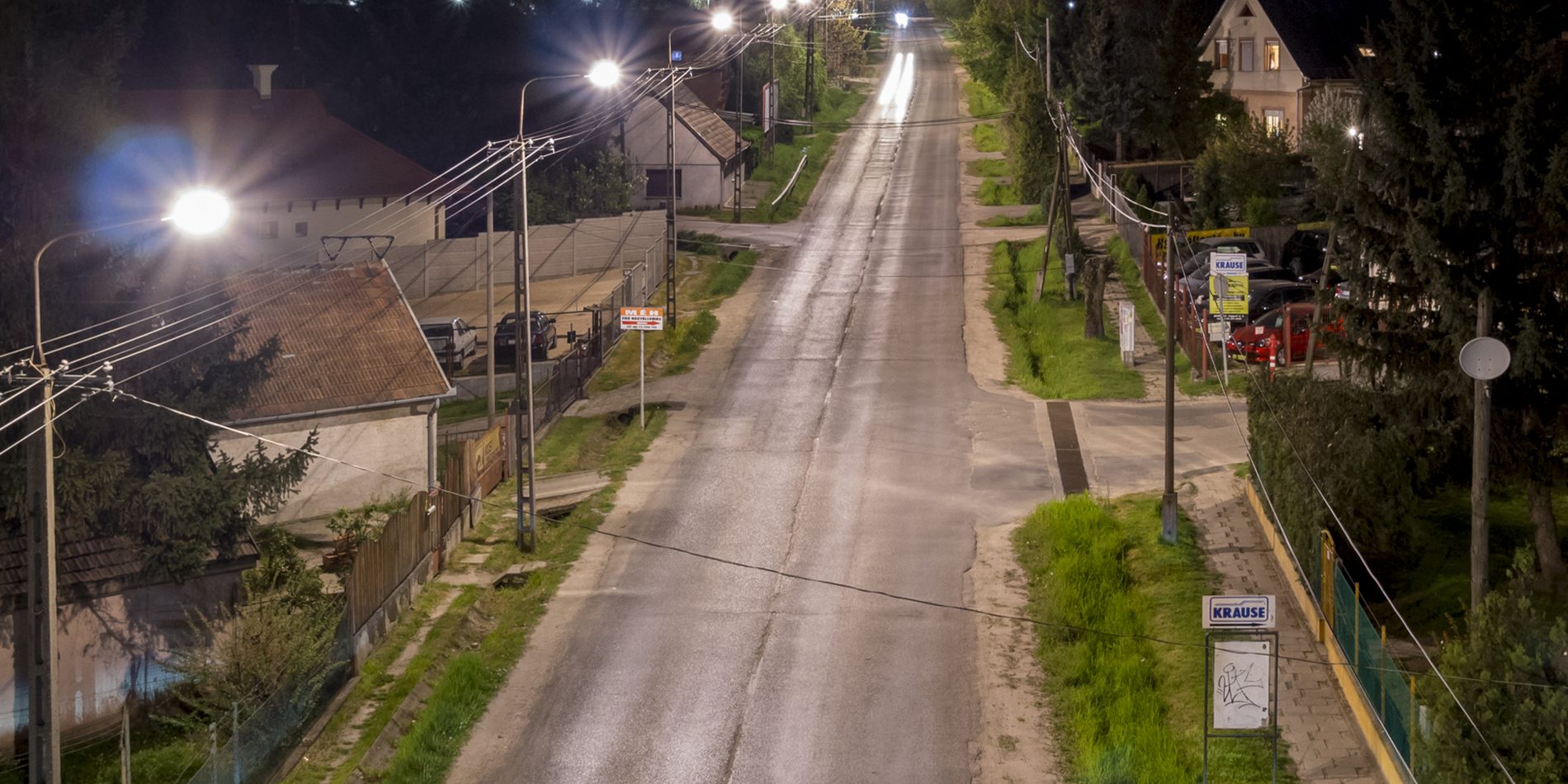 A street in Érd before modernisation, with yellowish conventional public lighting